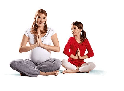 pregnant woman and her child beside her